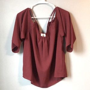 Exposed shoulder cranberry top from Franchesca’s.